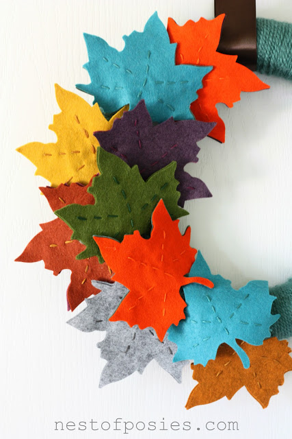 Fall Felt Leaf Wreath - would be gorgeous against any background.  Great pops of color! via Nest of Posies
