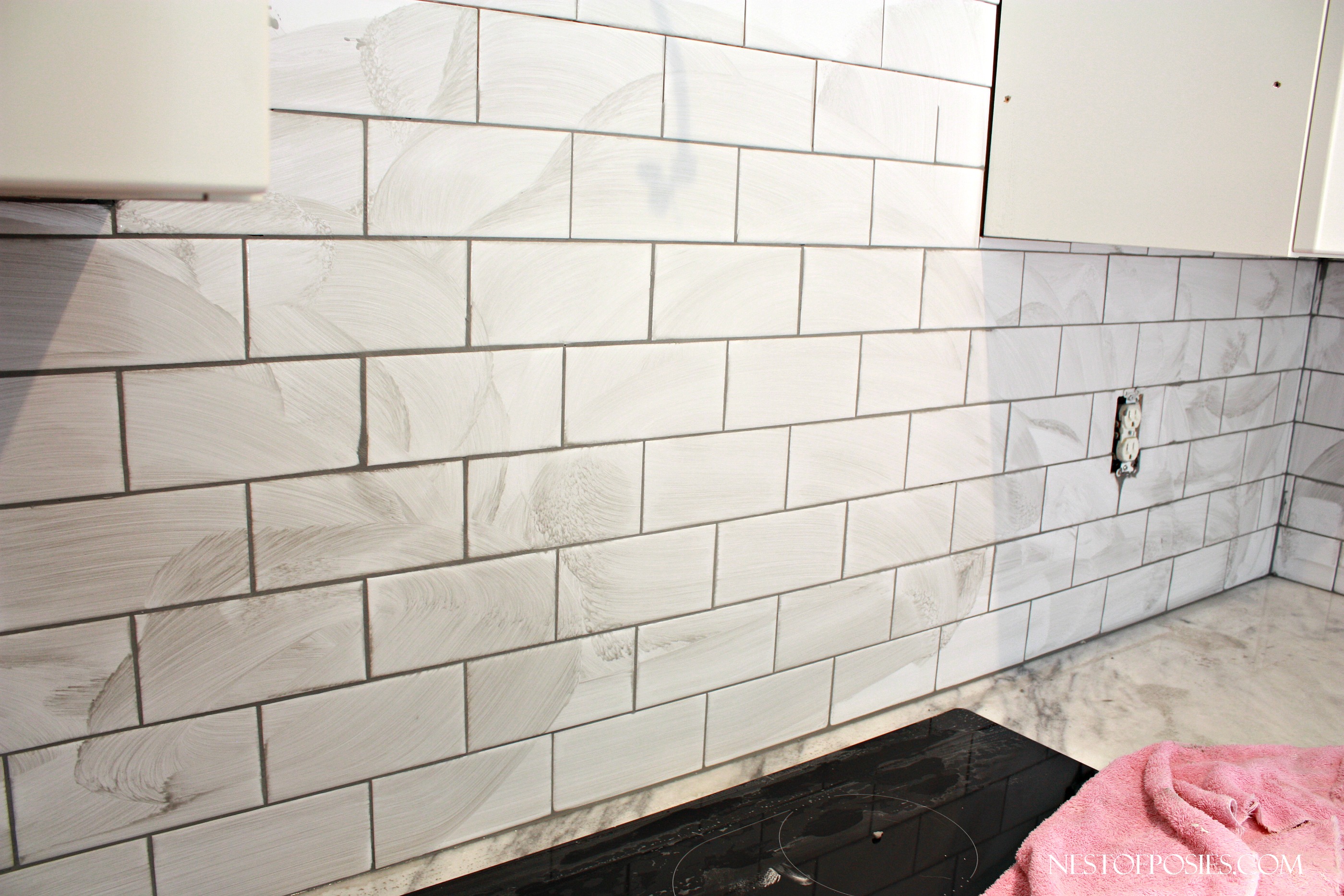 Grouting the subway tile backsplash