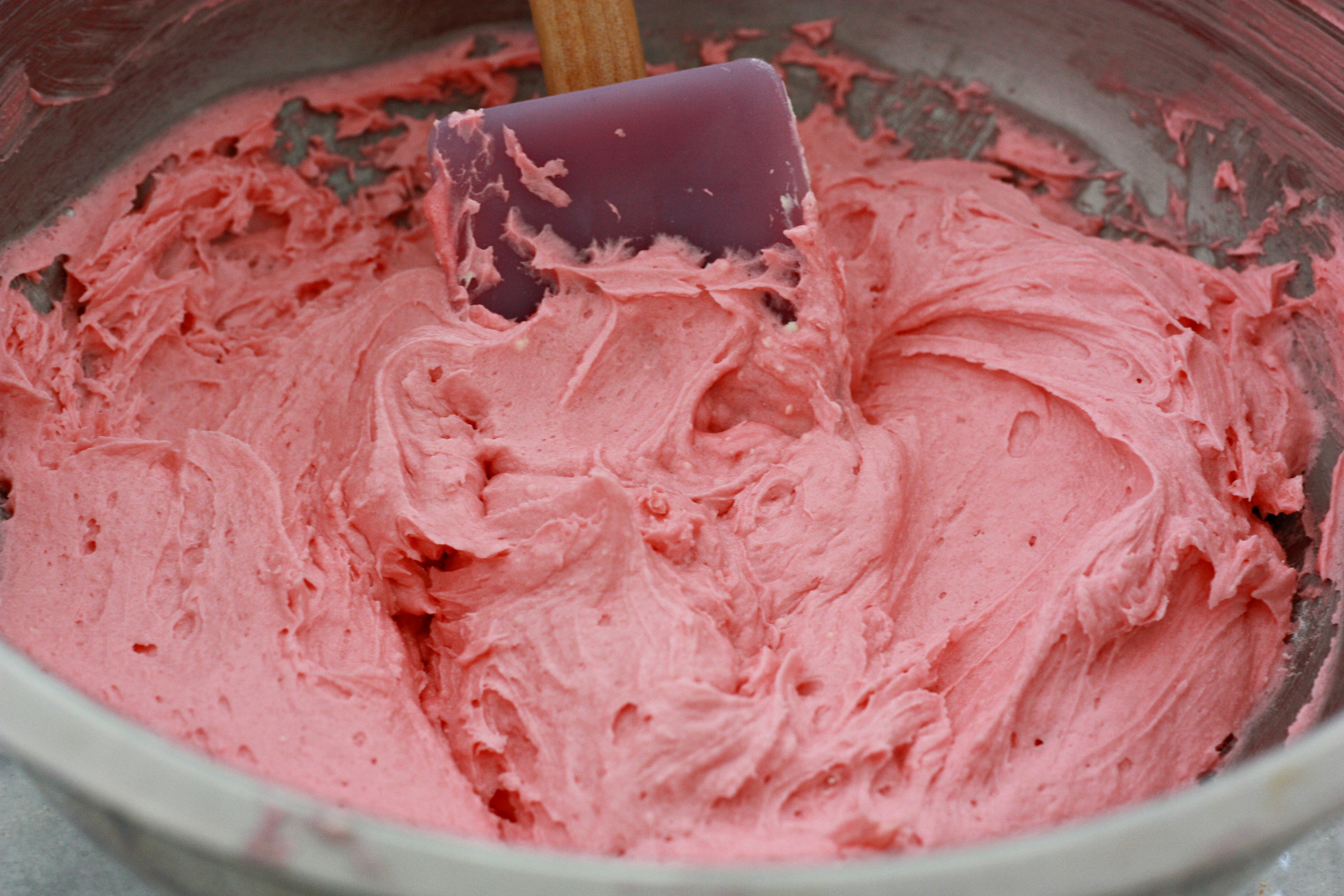 Make your cheesecake mixture pink by adding a couple of drops of food coloring