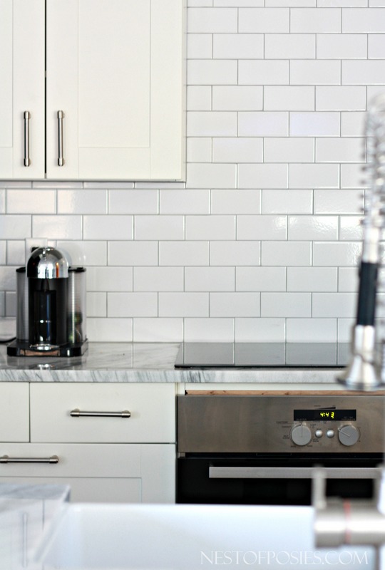 White Subway Tile, Carerra Marble and Ikea Cabinets